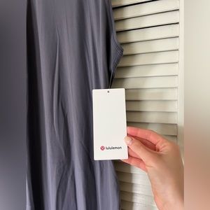 A full length Lululemon dress. It is a purple color with a razor back.